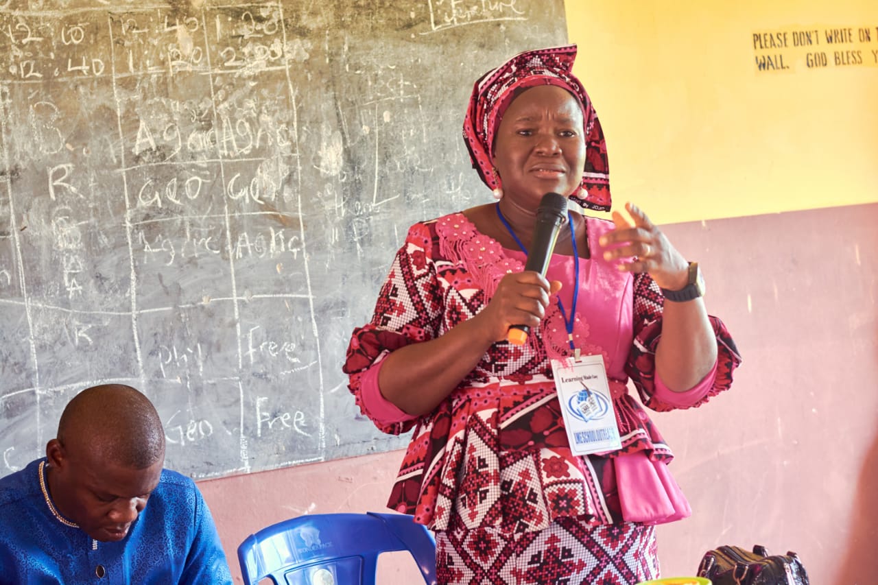 Female speaker with microphone