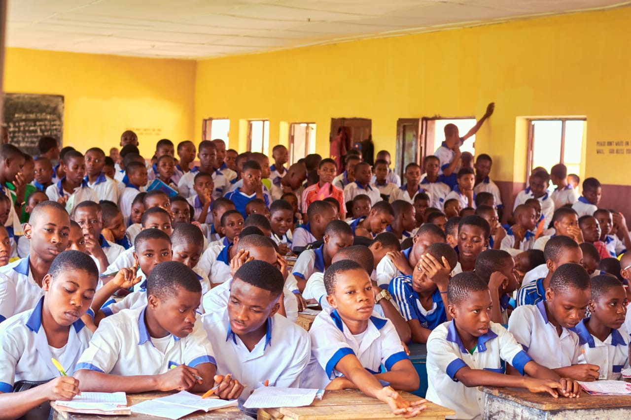 Speaker presenting with educational materials