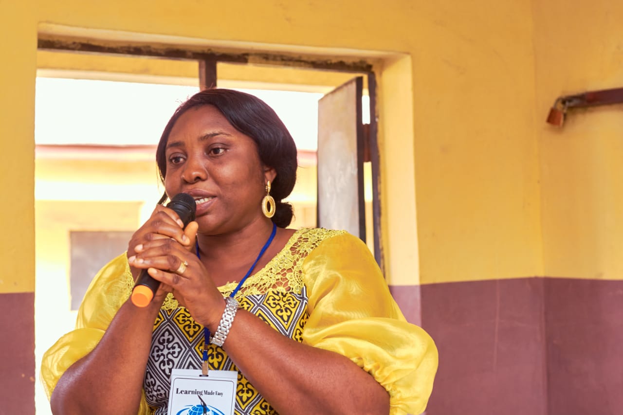 Staff member with materials and resources