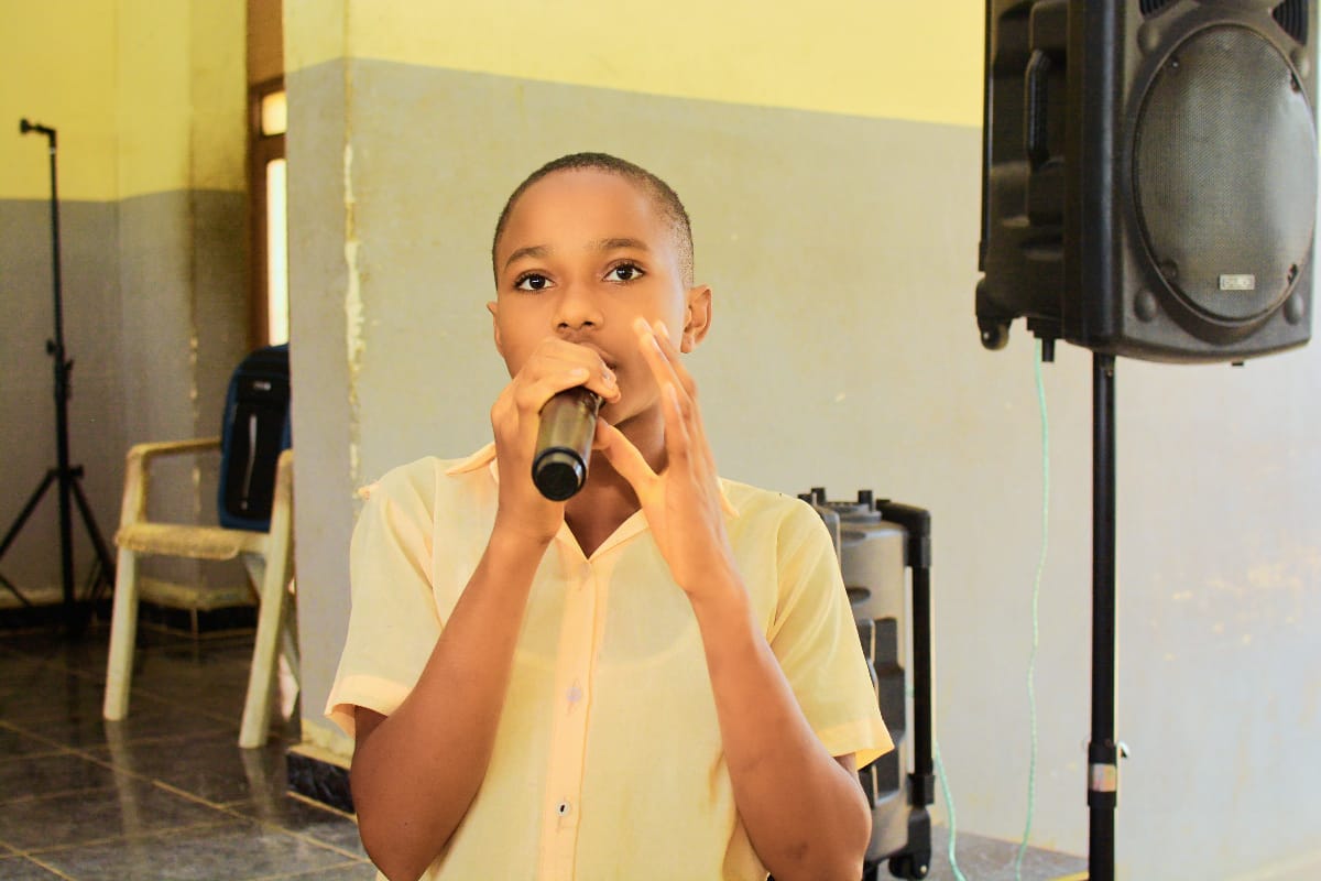 Full assembly of students in bright classroom