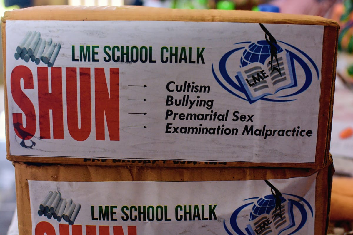 Group photo with staff and students holding LME Initiative banner