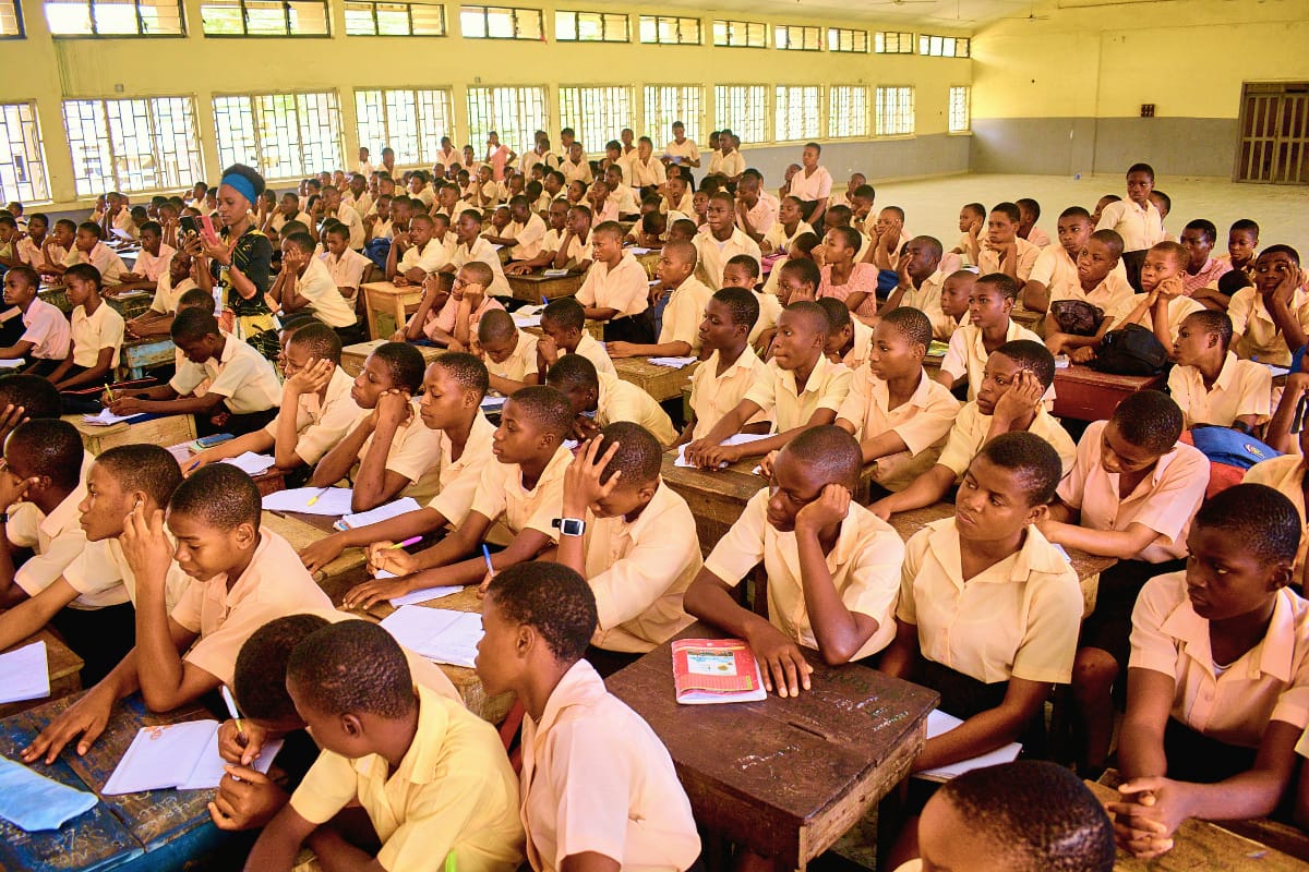 Large group assembly of students and staff